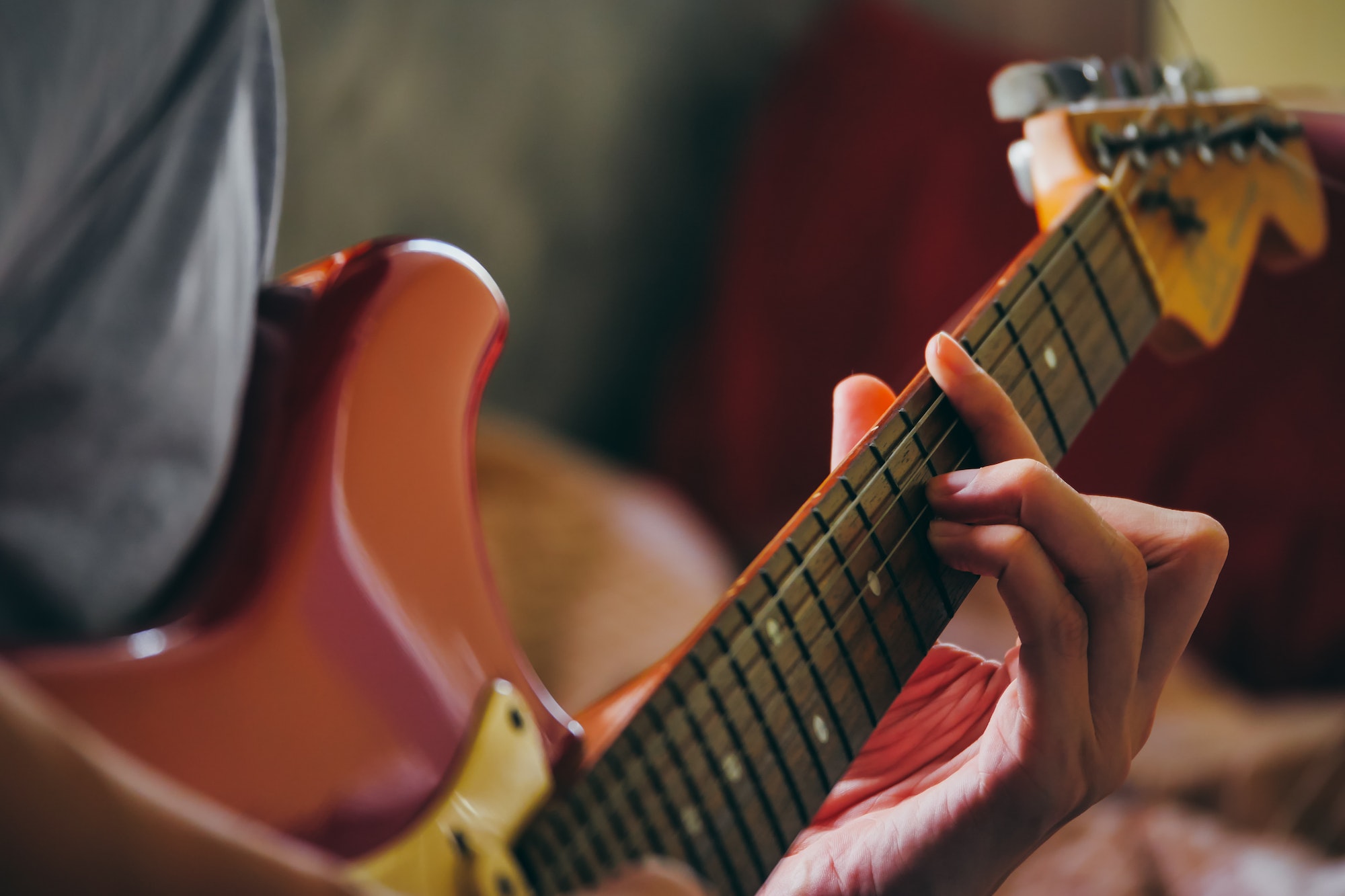 close-up-of-male-hands-playing-electric-guitar-selective-focus.jpg